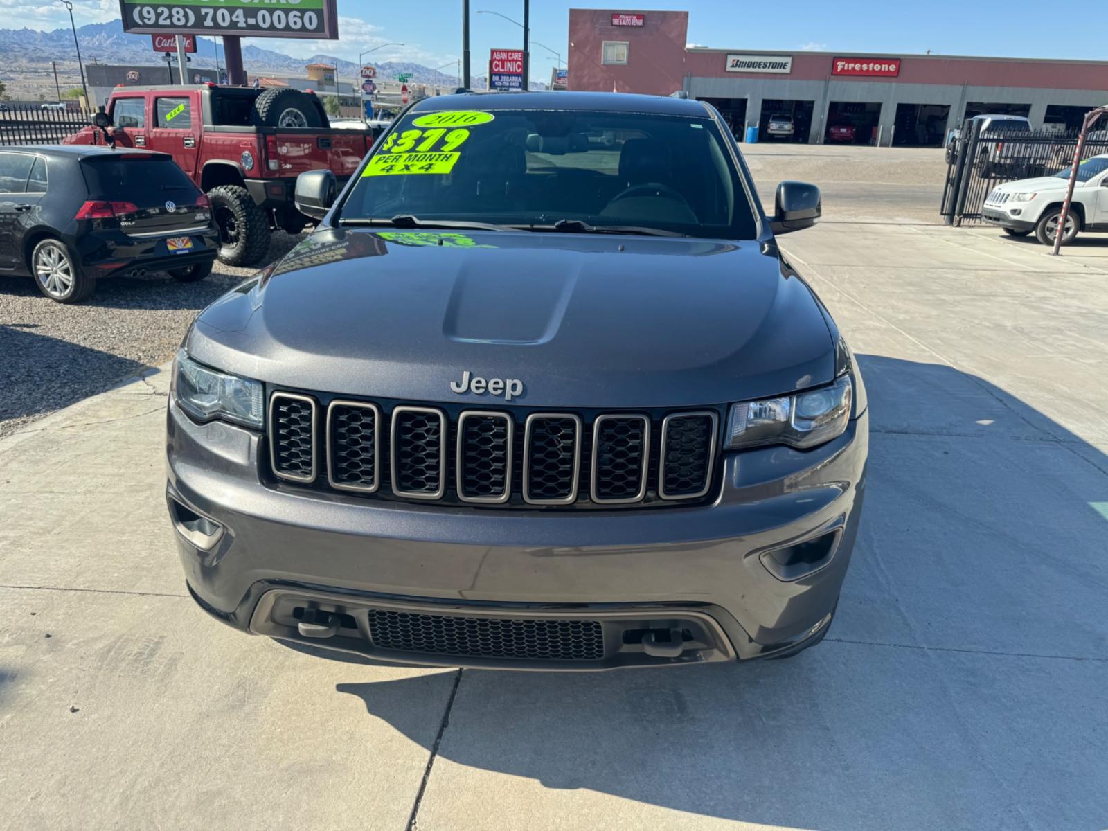 2016 grey Jeep Grand Cherokee (1C4RJFBG0GC) , located at 2190 Hwy 95, Bullhead City, AZ, 86442, (928) 704-0060, 0.000000, 0.000000 - 75th anniversary edition. clean carfax. jeep grand cherokee limited 4 wd. Leather loaded. 81k miles. free and clear title. - Photo #22